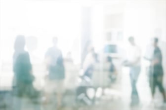 defocused-image-people-standing-city